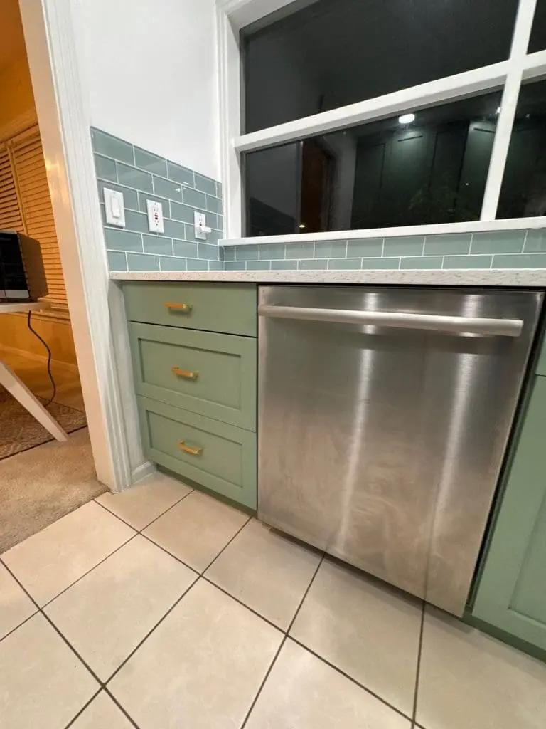 Sage green kitchen cabinets with gold hardware expertly painted by Refined Painting LLC in Seattle, WA.