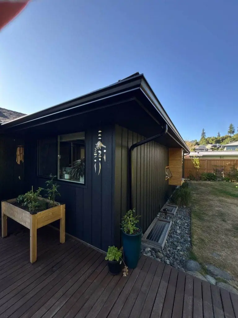 Custom black exterior trim and vertical siding detail by Painters in Refined Painting LLC in Seattle, WA.