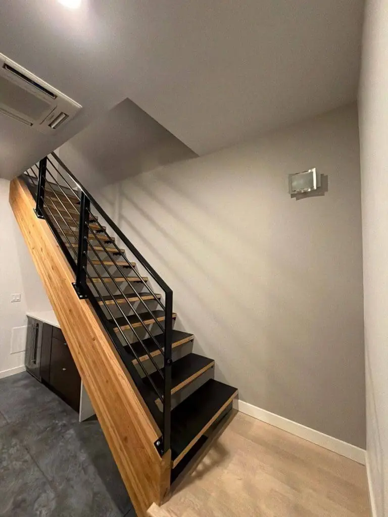 Modern stairwell and interior wall painted by Refined Painting, featuring clean lines and smooth finishes in a Seattle home