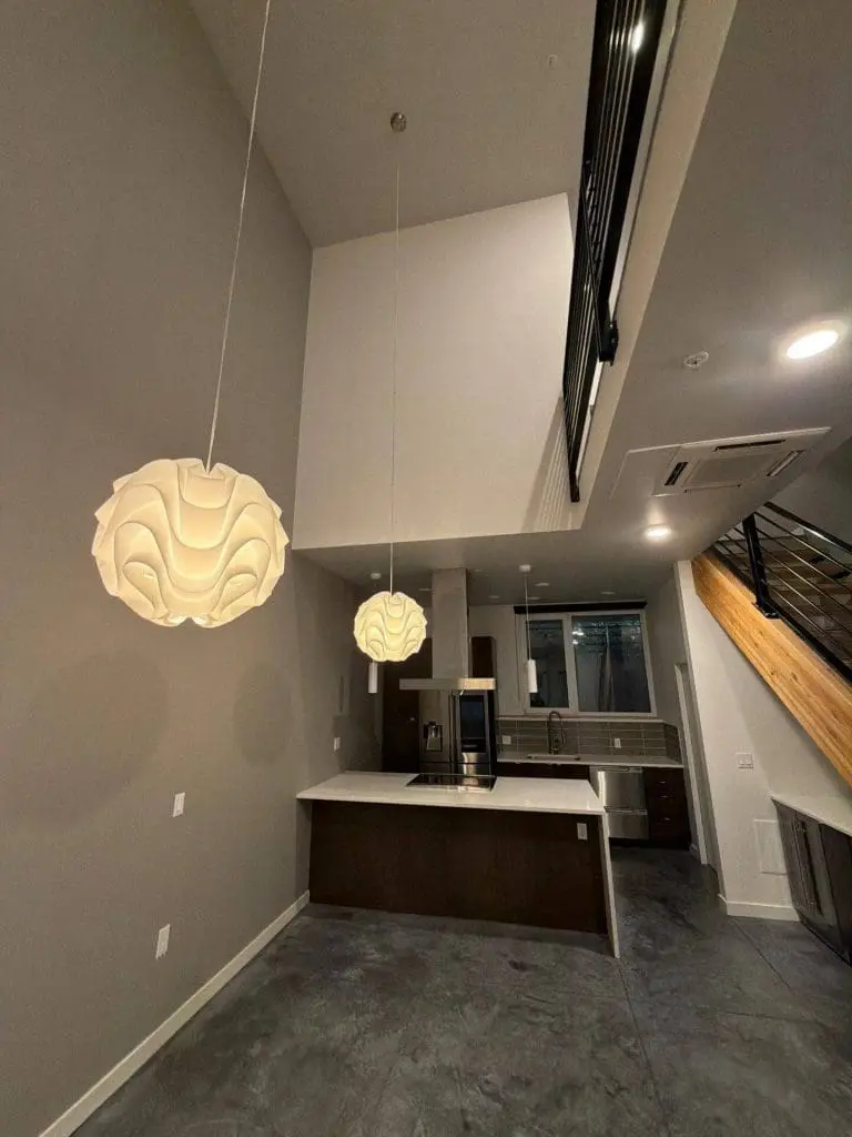 Modern interior kitchen and living space painted by Refined Painting, showcasing clean finishes and professional interior painting in Seattle